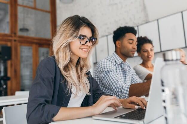 Group of entrepreneurs on their laptops in the office 