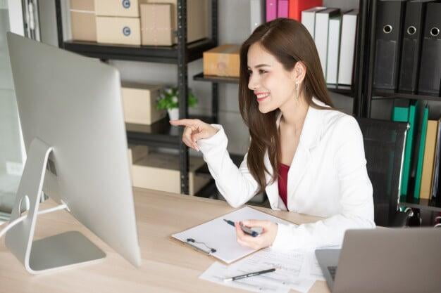 Picture of a woman on her computer.  She is discovering information to help make her more empowered.