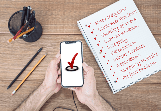 Picture of a cell phone and a notebook page with a list of business quality criteria each checked off in red